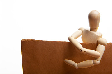 image of paper bag wooden mannequin