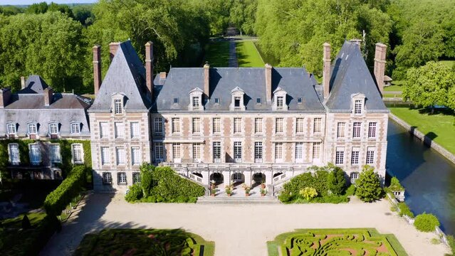 Aerial View Shot of Castle. Ch&acirc;teau. French castle. drone aerial view with landscaped gardens. Royal French Renaissance Castle and Gardens.  Aerial view drone flight around of Old fairytale castle. 