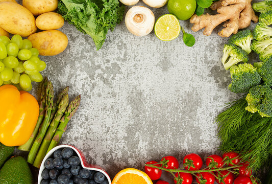 fresh fruits and vegetables arranged as frame