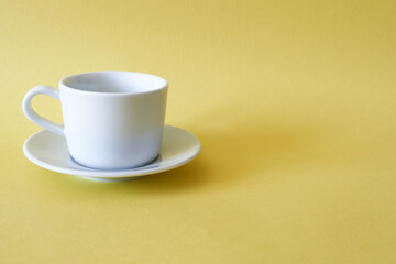 White tea pair on a yellow background. Space for copying.