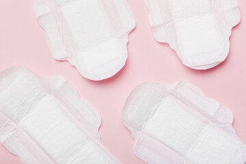 Women hygiene products or sanitary pad on colored background. Pastel color. Closeup. Empty place...