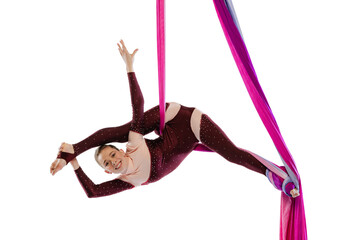 Portrait of young woman, air gymnast training, performing isolated over white studio background