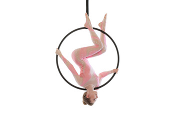 Portrait of young sportive girl, air gymnast performing on hoop isolated over white studio...