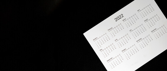 Close up 2022 calendar with banner size and copy space black background, schedule arrangement and...