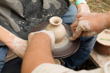 potter behind the potter's wheel