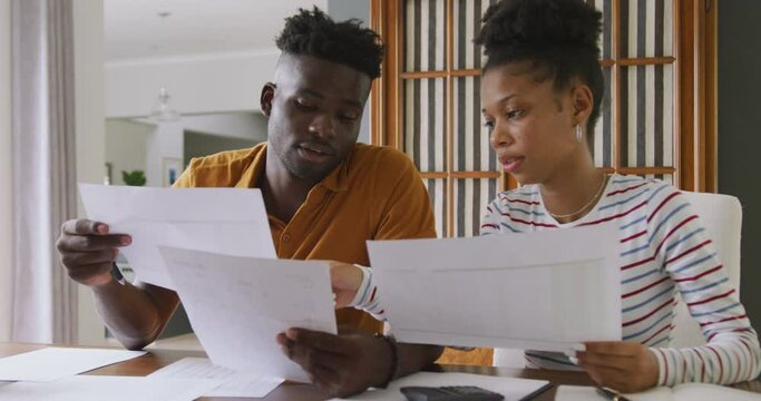 Video of focused african american couple planning home budget