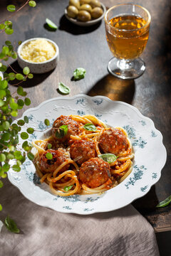 Spaghetti pasta with meatballs, tomato sauce and fresh basil
