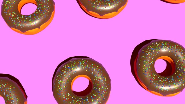Colorful chocolate donuts on pink background 