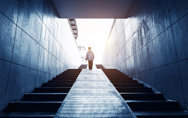 Men walking on the stairs of the underground