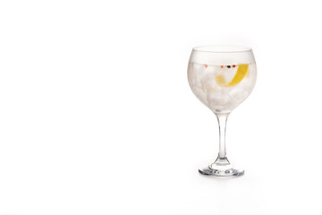 Gin tonic cocktail drink into a glass isolated on white background. Copy space