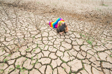 woman portrait in dryland with drought ground texture. concept climate changed.