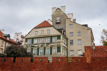 Warsaw, Poland, 13 October 2021: picturesque street with colorful buildings in historic center in medieval city, renaissance and baroque historical buildings near Barbican fortifications, sunny day