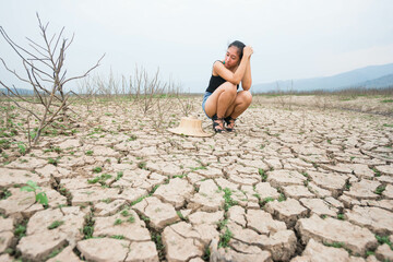 woman portrait in dryland with drought ground texture. concept climate changed.