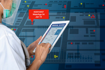 Female doctor searches for patient medical records on digital tablet to analyze epidemiological data.