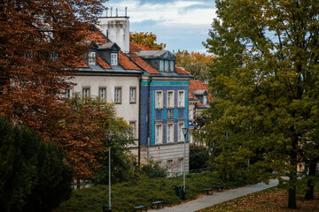 Warsaw, Poland, 13 October 2021: picturesque street with colorful buildings in historic center in medieval city, renaissance and baroque historical buildings near Barbican fortifications, sunny day