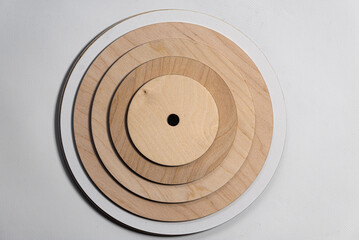 Wooden round and square and multi-shaped lining for the cake. Wood products. Laser cutting