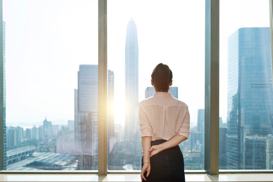 Businesswoman standing in front of the window
