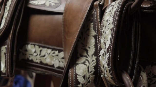 SADDLE FOR HORSE WITH CHARRO DETAILS AND MEXICAN PATTERNS EMBROIDERED BY HAND