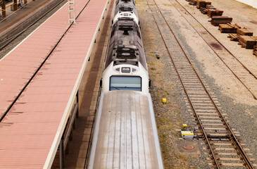 Aerial view of train on railroad tracks in station