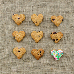 Homemade heart shaped cookies on burlap fabric