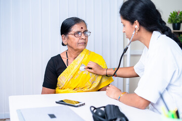 doctor examining health of senior sick patient at hospital - concept of treatment, routine checkup...