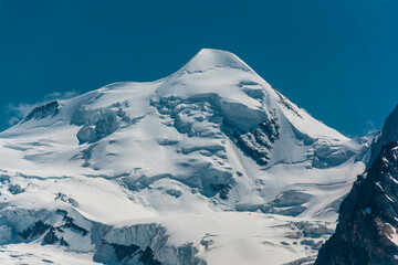 The snow and ice-covered north face of Castor mountain (4.223 m) near Zermatt, Switzerland - obrazy, fototapety, plakaty