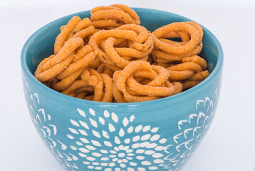 Murruku (aka Chakli) a south Indian fried snack made from rice flour and ghee butter. Murruku is made during festivals like Diwali, Navratri, Pongal, Deepawali