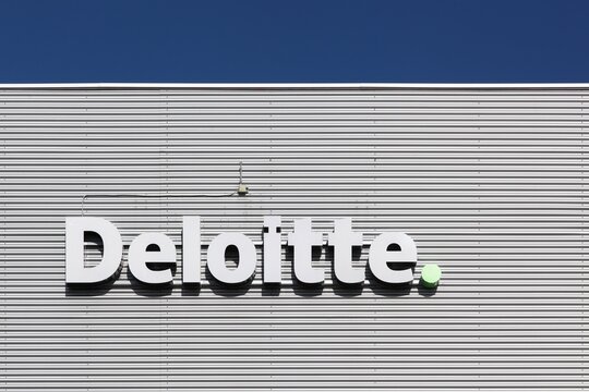 Aalborg, Denmark - July 13, 2017: Deloitte logo on a wall. Deloitte is one of the Big Four accounting firms and the largest professional services network in the world by revenue