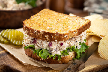 Tuna salad and lettuce sandwich on whole grain bread - 504163257