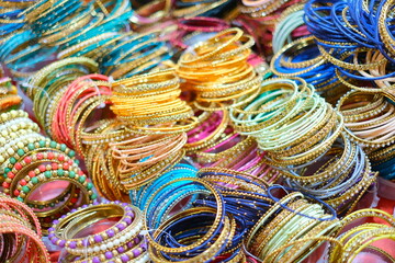 Colourful Indian women's bangles wrist bracelets on display in the market of delhi india.