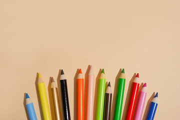 Colored pencils on light background with copy space