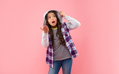 shocked kid with curly hair in hood. teen hipster beauty hairstyle. female casual fashion model.