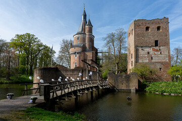 Access bridge over the moat leading to the fortress brick remains and round fairy-tale tower of...