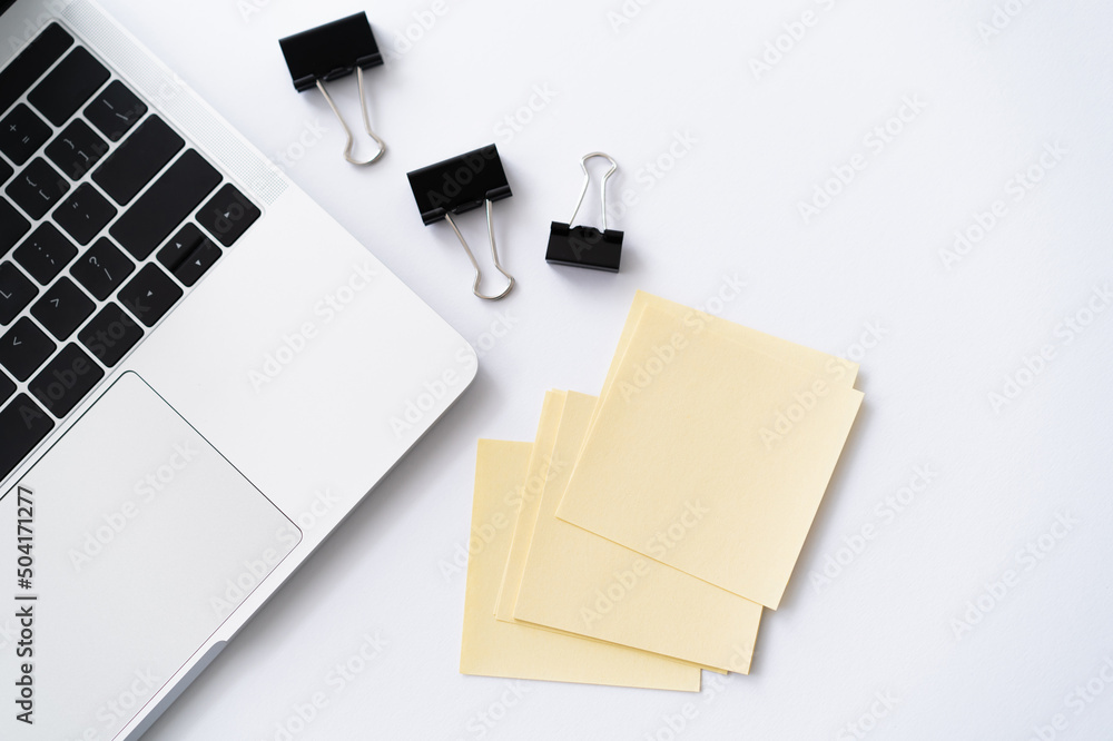 Canvas Prints top view of laptop near stationery on white.