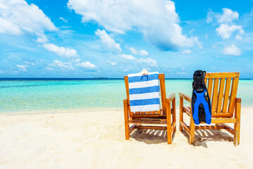 Couple of   wooden chair standing on a beach Indian Ocean.