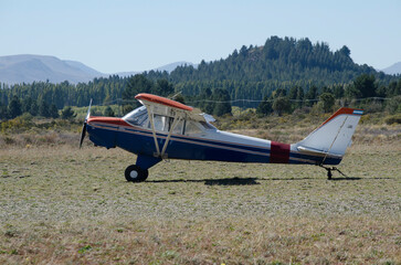 light plane on its side taxiing to take off