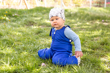 baby boy portrait of child outdoor with strabismus eyes