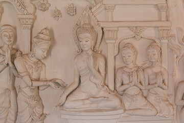 Fototapeta na wymiar Buddha statue on temple wall