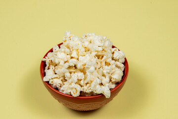 A ceramic bowl of salted popcorn