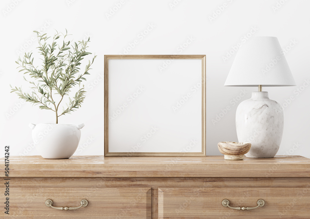 Fototapete Square wooden frame mockup in traditional living room interior with classic chest of drawers, marble lamp and small olive tree on white wall background. Illustration, 3d rendering