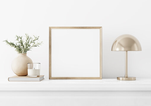 Painting art mockup with empty square wooden frame standing in simple traditional home interior with olive twigs in vase, candle and brass lamp on white background. Illustration, 3d rendering