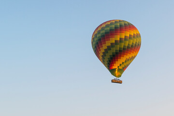 Colorful hot air balloon in the sky with copy space
