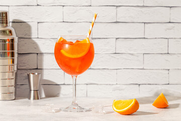 Glass of cold Aperol spritz cocktail.