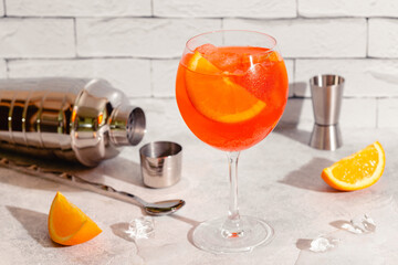 Glass of cold Aperol spritz cocktail.