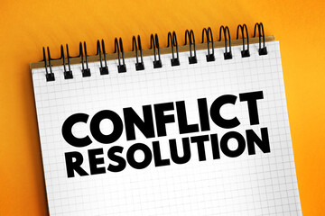 Conflict resolution - way for two or more parties to find a peaceful solution to a disagreement among them, text concept on notepad