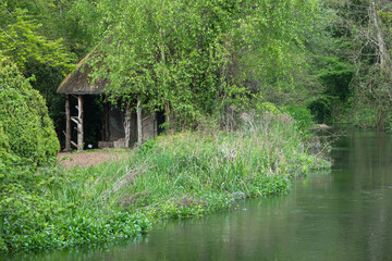 old wooden fishing hut on the banks of  the River Test