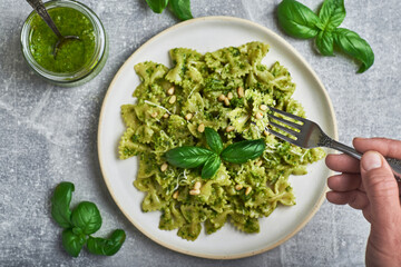 Pasta with basil pesto sauce. Farfalle pasta with basil pesto sauce. Pasta al pesto genovese.