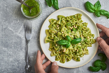 Pasta with basil pesto sauce. Farfalle pasta with basil pesto sauce. Pasta al pesto genovese.