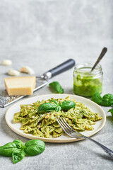Pasta with basil pesto sauce. Farfalle pasta with basil pesto sauce. Pasta al pesto genovese.