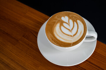 hot latte art coffee on table, relax time